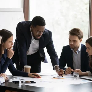 Business-Insurance-View-of-a-Small-Team-of-Business-People-Discussing-Strategy-During-a-Meeting-in-a-Small-Office